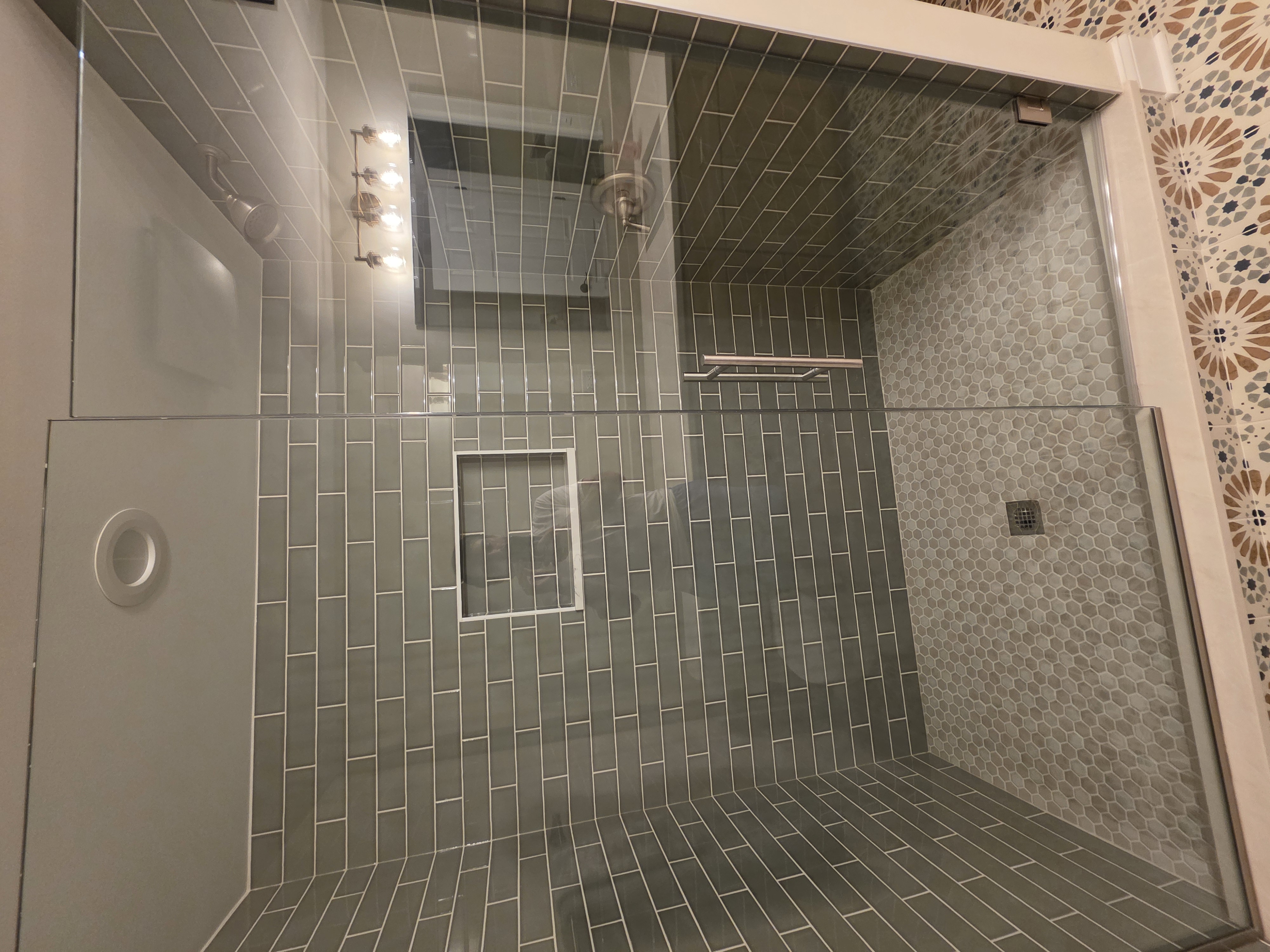 Custom glass shower with gray subway tile