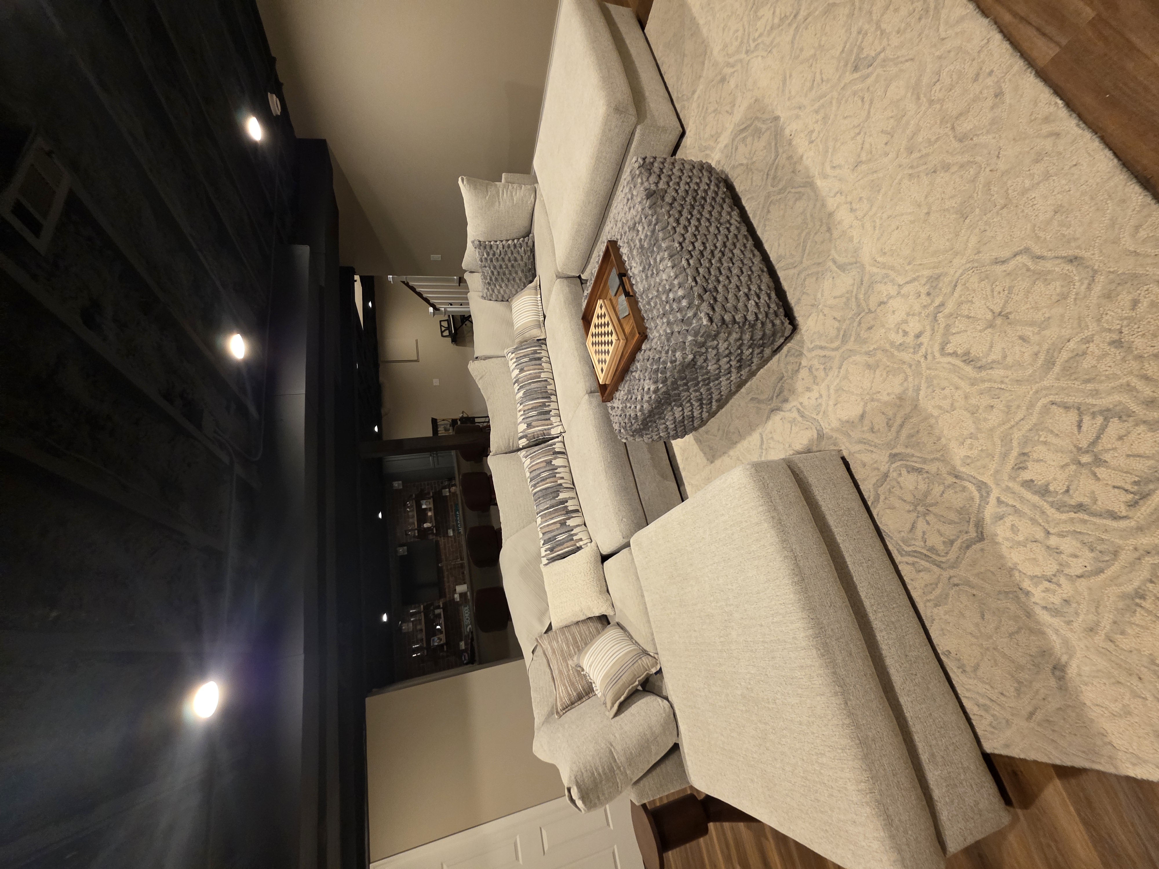 Finished basement with lounge area by M&M Construction